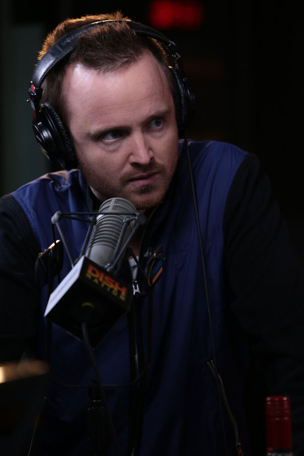 Aaron Paul talking with the cast