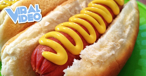 Viral Video: Kid struggles to eat a hot dog at baseball game